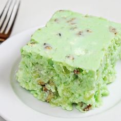 a piece of cake sitting on top of a white plate