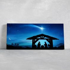 a nativity scene with the birth of jesus and three wise men under a starry sky