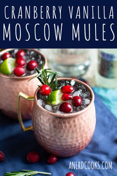 two cranberry vanilla moscow mules in copper mugs with garnishes