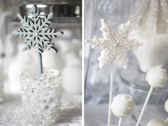 snowflakes and marshmallows are sitting in vases on the table