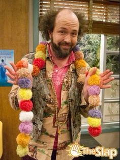 the big bangzle show's character is dressed in colorful pom - poms