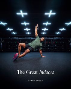 a man is doing an exercise on the floor with his hands up in the air