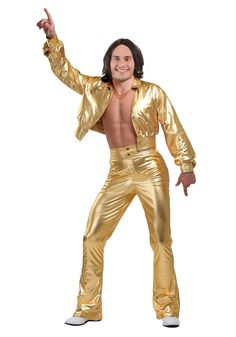 a man dressed in gold is posing for the camera with his shirt open and hands up