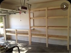 the inside of a garage with shelves in it