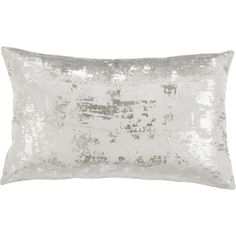 a white pillow with silver sequins on the front and back, sitting on a white background