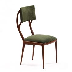 a wooden chair with a green upholstered seat and back cushion on an isolated white background