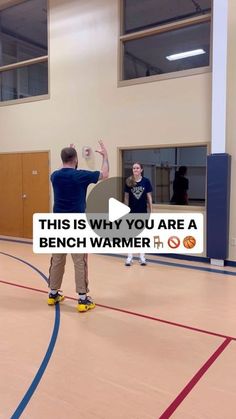 two men are playing basketball in an indoor court with the words, this is why you are a bench warmer