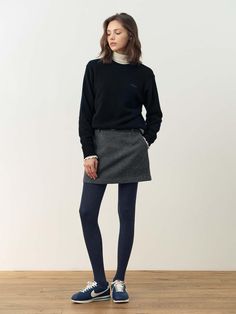 The Amanda Wool Mini Skirt is a versatile piece that can be styled in multiple ways. It comes in two color options, Gray and Pink, each offering a unique look to your outfit.- Made from 100% wool fabric for a vintage-inspired touch- Can be paired as a set with matching outerwear for a coordinated ensemble- Features a semi low-rise design that sits comfortably on the hips Winter A-line Mini Skirt With Lining, Chic Wool Mini Skirt, Classic Wool Mini Skirt, Chic Gray Mini Skirt, Wool Mini Skirt With Lined Detail, Wool Mini Skirt, Winter Leggings, A Line Mini Skirt, Wool Fabric