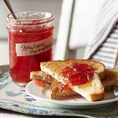 there is a sandwich on a plate with ketchup in a jar next to it