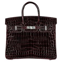 A rare Hermès 25cm Birkin bag. The exterior of this bag is crafted in Bordeaux shiny Niloticus Crocodile skin with tonal stitching. It features palladium hardware and two top handles with a front toggle closure. The interior features a zipper pocket with an Hermès engraved zipper pull and an open pocket on the opposite side. The bag comes store fresh with full set, complete with factory stickers on all hardware. Date stamp is a B without a surrounding shape - 2023 production. The bag measures 25 Hermes Crocodile Bag, Date Stamp, Fashion Capsule Wardrobe, Crocodile Bags, Modernist Jewelry, Hermes Box, Togo Leather, Kelly Bag, Vintage Hermes