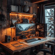 a desktop computer sitting on top of a wooden desk in front of a large window