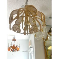 a chandelier hanging from the ceiling in a room with other items on it