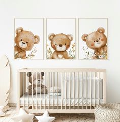 a baby's room with two teddy bears on the wall and a crib