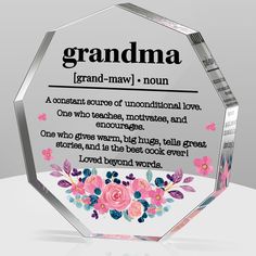 a glass award with the words grandma and flowers on it's front side, sitting on a white surface