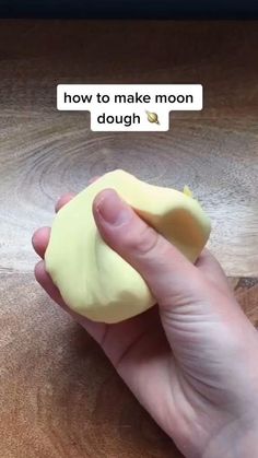 a person holding a piece of food in their hand with the words how to make moon dough on it