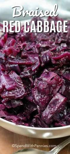 cooked red cabbage in a bowl with spoons on the side and text overlay that reads, braised red cabbage