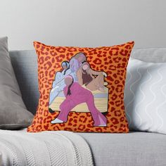 an orange leopard print throw pillow with a woman in pink on the front and back