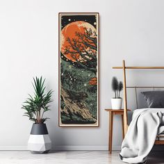 a bedroom with a bed, plant and poster on the wall above it that has an orange moon in the sky