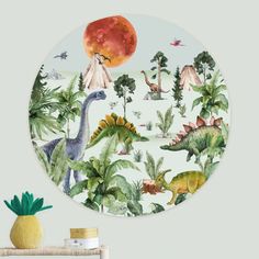 a plate with dinosaurs and trees on it