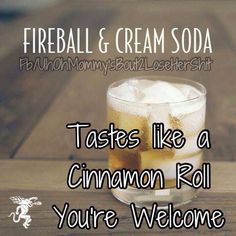 there is a glass with ice in it and the words fireball & cream soda tastes like a cinnamon roll you're welcome