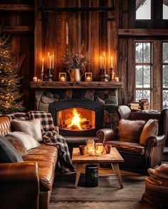 a living room filled with furniture and a fire place next to a window covered in candles