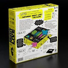 the box is yellow and has black writing on it that says live, saturday night live, the game