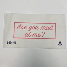 an embroidered label with the words are you mad at me?