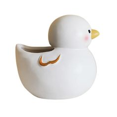 a white rubber ducky with gold accents on its head and tail, sitting in front of a white background