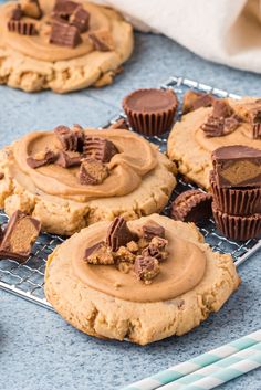 peanut butter cupcakes with chocolate frosting on a cooling rack