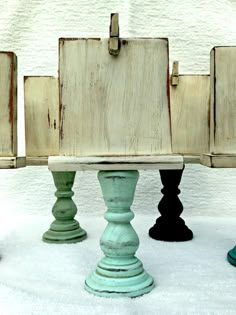 an old wooden bench sitting in the snow