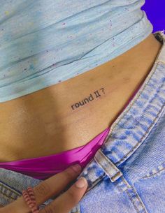 a woman's stomach with the word round written on her lower back and right side