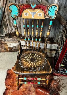 an old wooden chair has been decorated with beads