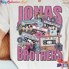 a person wearing a t - shirt with the words jonas brothers on it and an image of people in cassette tapes