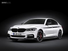 the new bmw m5 sedan is shown in an image taken from above, on a dark background