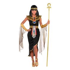 an egyptian woman dressed in black and gold holding a golden staff with her hands on the hips