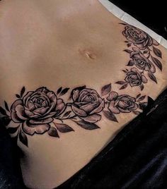 a woman's stomach with roses on it