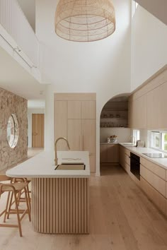 a kitchen with wooden cabinets and white counter tops