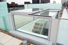 an open window on the roof of a building