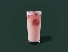 a tall glass filled with pink liquid