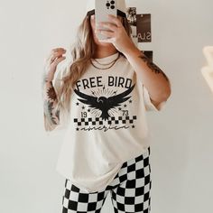 Show off your trendy aesthetic in our vintage feel free bird shirt. This stylish rocker graphic tee is slightly distressed and oversized with a relaxed fit. * Ultra soft * Distressed design * Pre-shrunk * Universal fit * True to size * DTG Printing * Brand - Comfort Colors Refunds/Exchanges: * No Cancellations * No returns/exchanges * All sales are final Sizing: Our graphic tees and sweatshirts are a true to size standard unisex fit. For an oversized look, please size up. For a TShirt dress fit, we recommend sizing up at least two sizes. Please oversee the sizing chart provided in the listing photos to ensure your measurements are correct as we DO NOT offer cancellations, exchanges or returns. Shipping: All products are made to order and are usually ready to ship within 2-7 business days. Rock And Roll Tshirt, Vintage Band T Shirts, Tshirt Oversized, Bird Shirt, Vintage Band Tees, Free Bird, Hippie Shirt, Band T Shirts, Trendy Graphic Tees