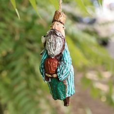 an ornament is hanging from a tree