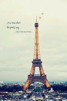 the eiffel tower in paris is lit up for valentine's day with love