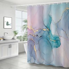 a bathroom with a marble shower curtain in the shape of an abstract painting on it