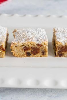 three pieces of cake on a white plate