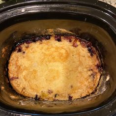 a crock pot filled with food sitting on top of a counter