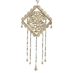 an intricately designed wind chime hanging from a chain with beads and tassels