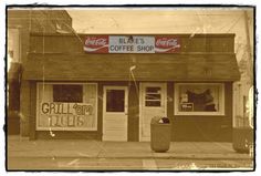 an old photo of a coffee shop