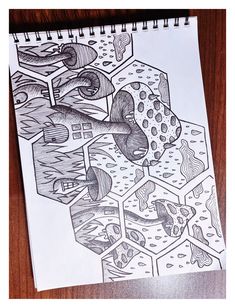 a drawing on top of a piece of paper next to a pen and ink marker