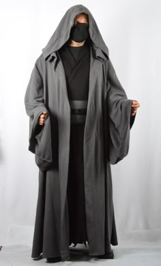 Gray Jedi suit, warrior. This costume can be used for cosplay and other activities. The set includes a gray cape with wide sleeves and a black long sleeveless shirt with a distressed hem. The belt is gray or black. The gray cloak is made of three-thread, and the lower tunic is made of two-thread. Composition of material - knitted cotton. Please refer to our size chart for size selection. Pictured is size XL. The model is 175 cm tall and has a chest circumference of 104 cm. Male Jedi Outfit, Black Elvish Costume For Costume Party, Black Elvish Costume For Fantasy Events, Black Warrior Cosplay Costume For Fantasy Events, Black Warrior Cosplay Costume For Larp, Grey Jedi Armor, Wizard Costume Male, Sith Outfit, Grey Jedi Cosplay