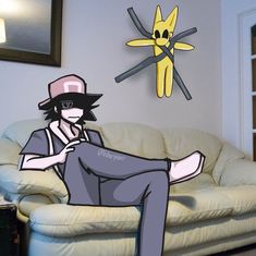 a man sitting on top of a couch in front of a cartoon wall mounted clock